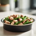 A close-up of a low-calorie plate featuring chicken and green beans, perfect for weight control.