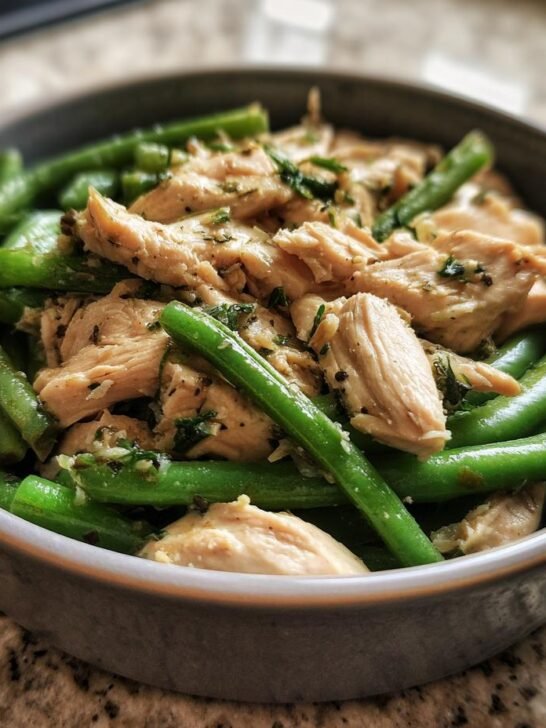 A close-up of a bowl filled with a chicken and green bean low calorie plate for weight control.
